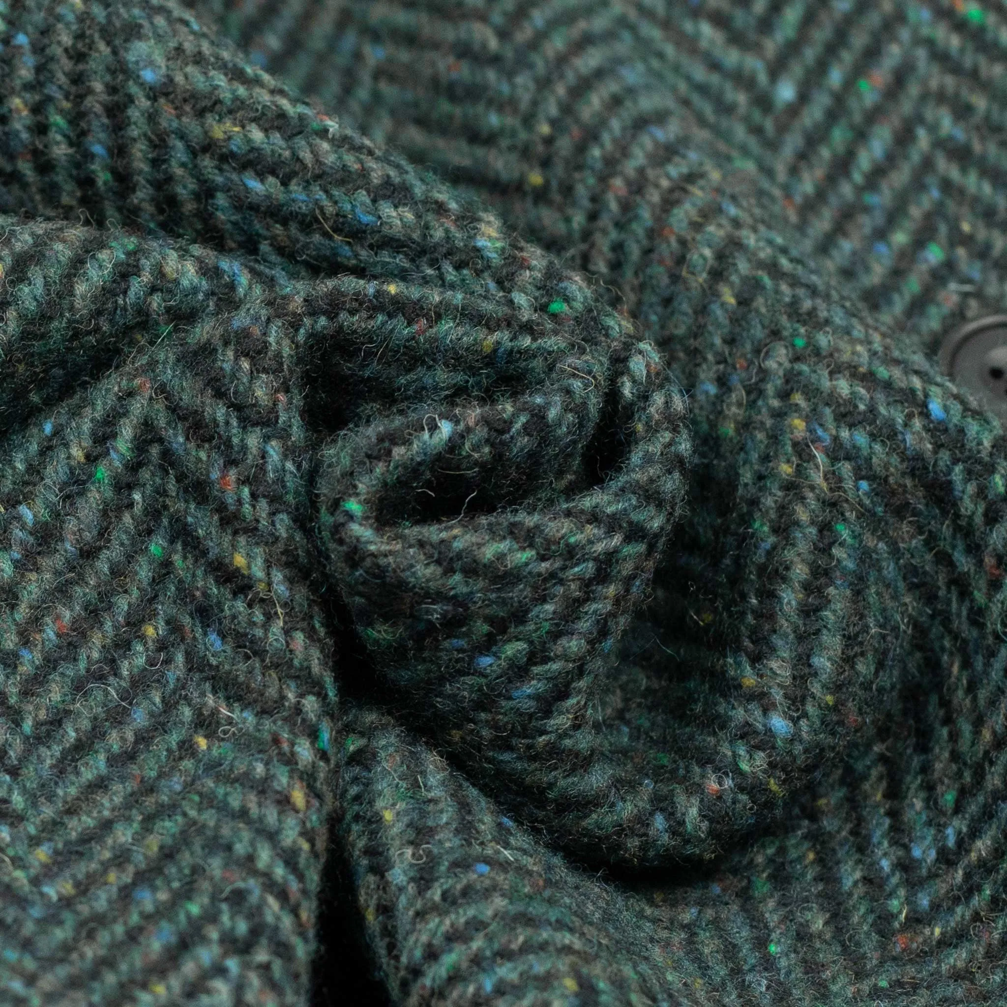 Belted balmacaan coat in handloomed Donegal blue-green herringbone tweed